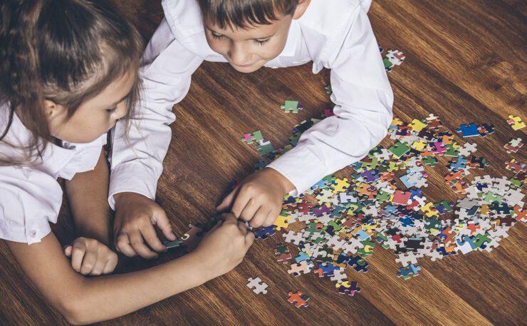 kids playing puzzle