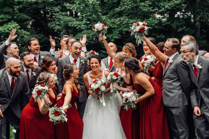 Bright Bridesmaids Dresses Red Orange Wedding Party Smiling with Bride and Groom Saphire Estate scaled