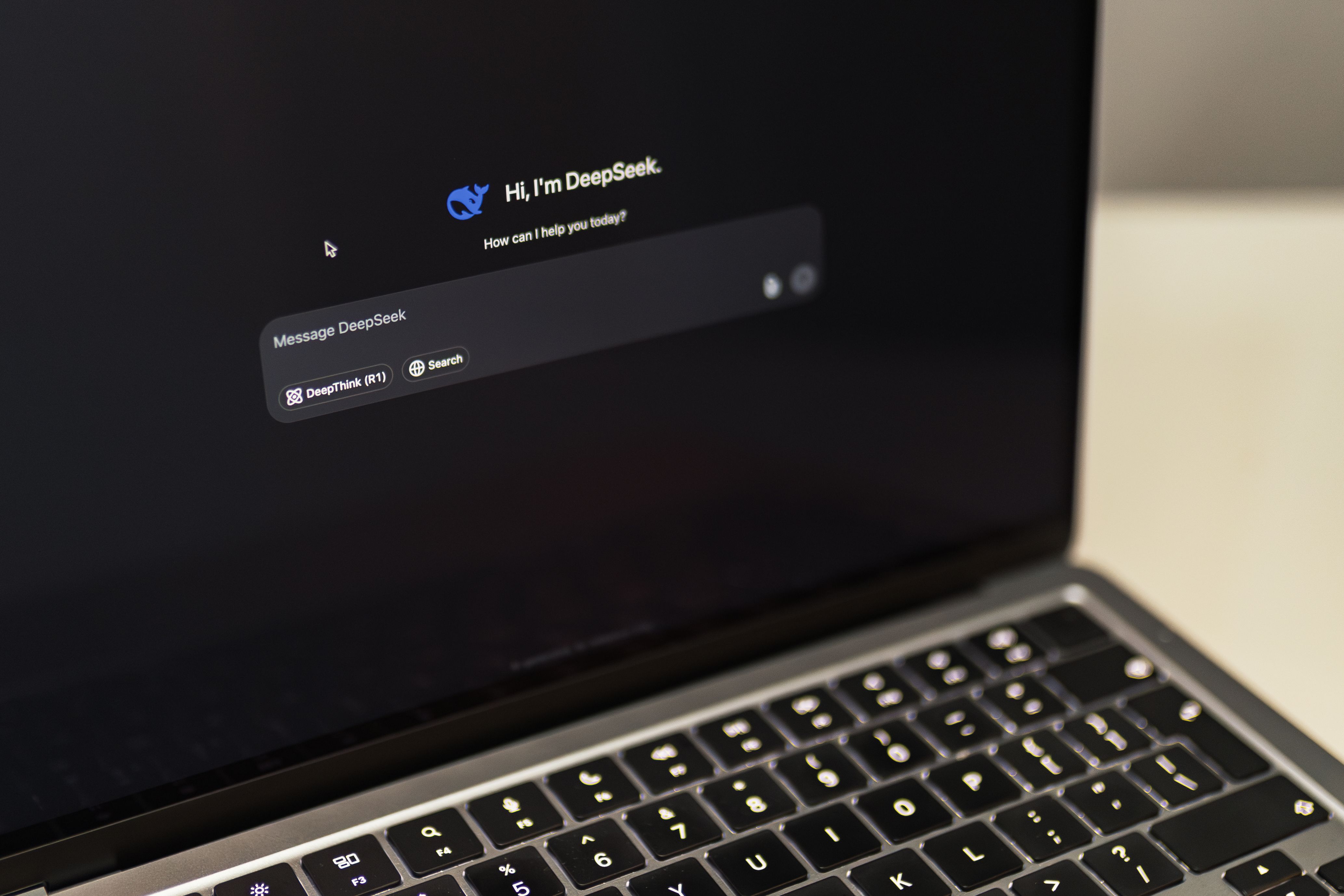 Laptop screen showing an AI chatbot interface generating text